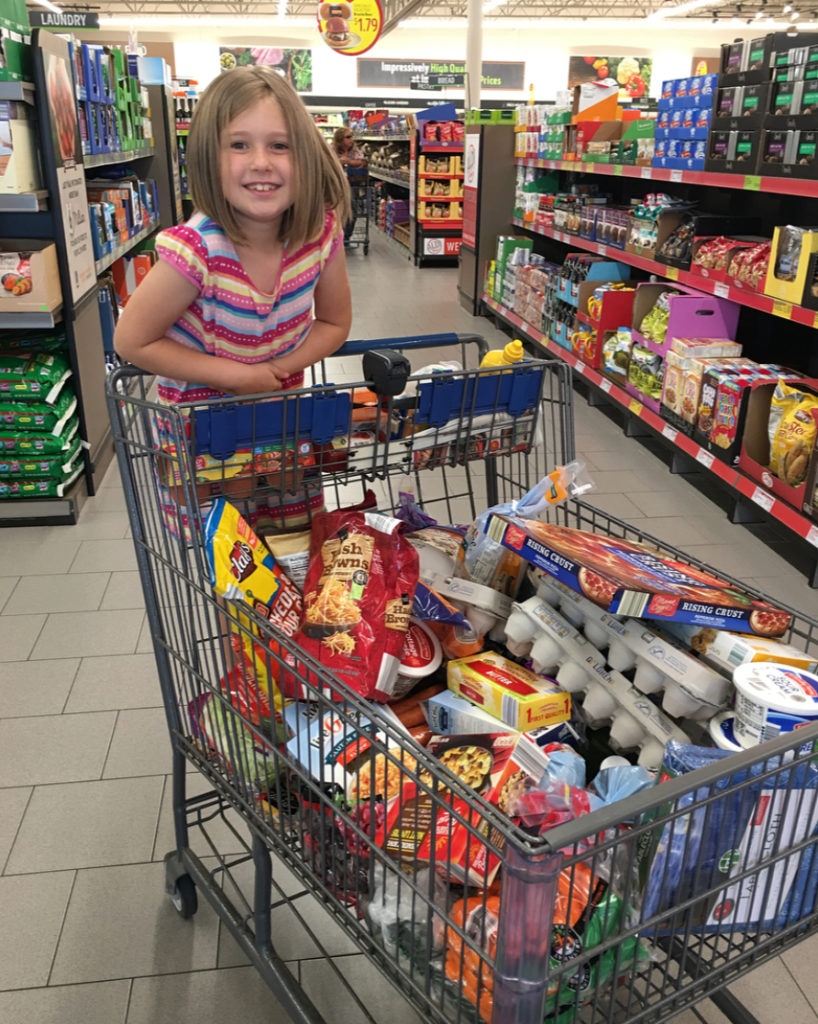 daughter helping with grocery shopping