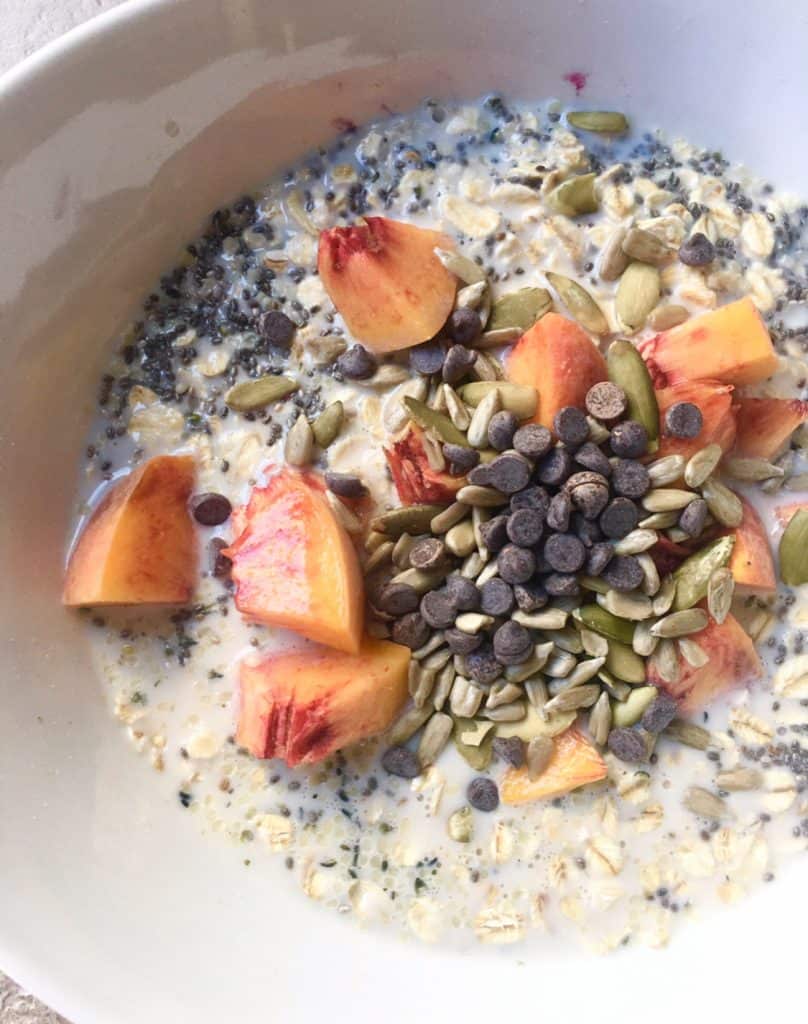 raw oatmeal with fresh peaches