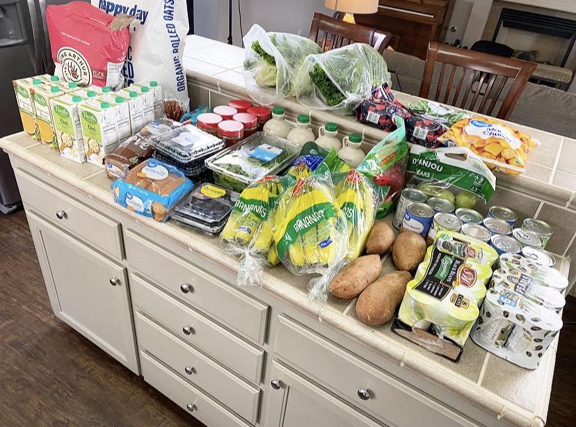 kitchen counter filled with produce and bulk buying foods