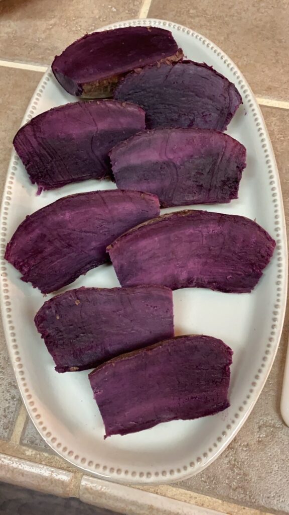 cream platter with sliced and cooked purple sweet potatoes