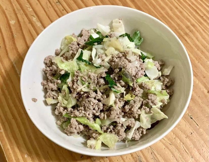 white bowl filled with egg roll in a bowl