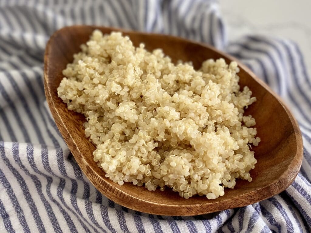 easy cooked quinoa in wooden bowl 