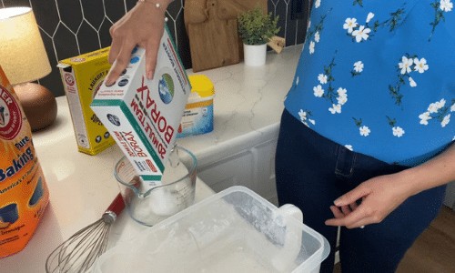 adding dry ingredients to make dry laundry soap
