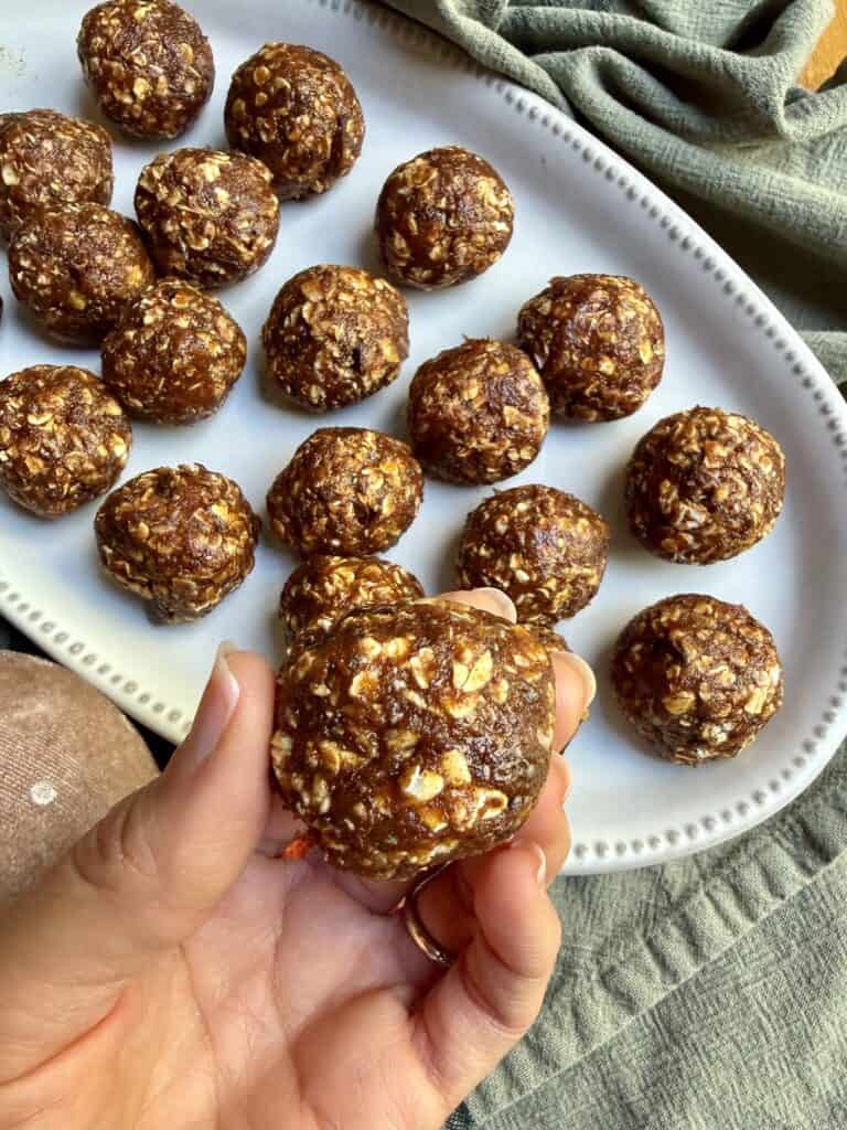 Aimee from Homemaker On A Budget serves up easy and delicious pumpkin oatmeal energy bites on a tray.