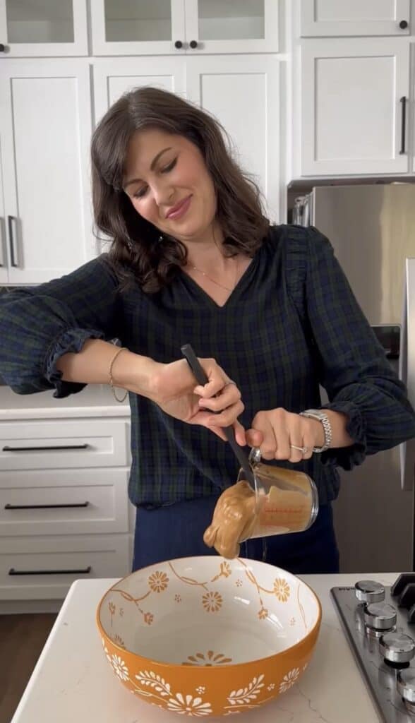 Aimee from Homemaker On A Budget mixes ingredients to make pumpkin oatmeal energy bites packed with immune boosting benefits.