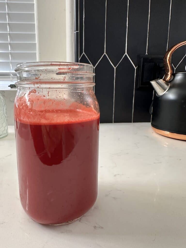 Aimee from Homemaker on a Budget blends apples, carrots, beets for maximum benefit juice!