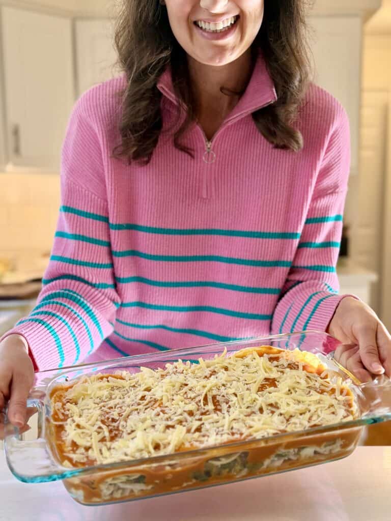 Aimee from Homemaker on a Budget prepares to bake chicken enchilada casserole.