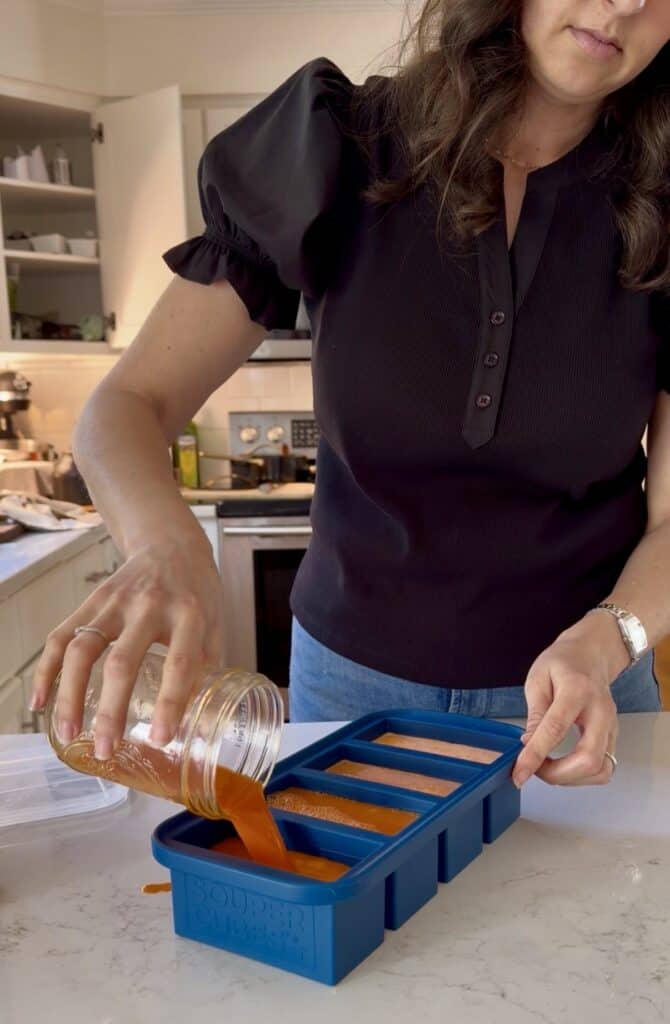 aimee pouring apple beet carrot juice into souper cubes