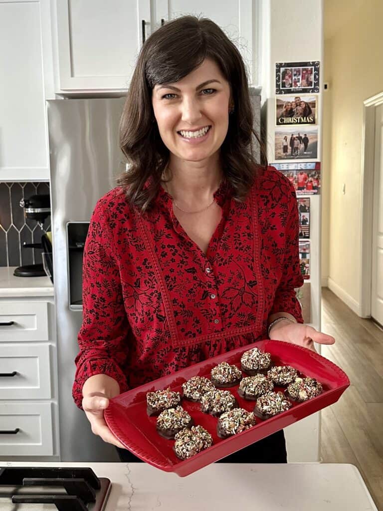 Aimee from Homemaker on a Budget presents chocolate dipped Nut Clusters with dark chocolate with nuts.