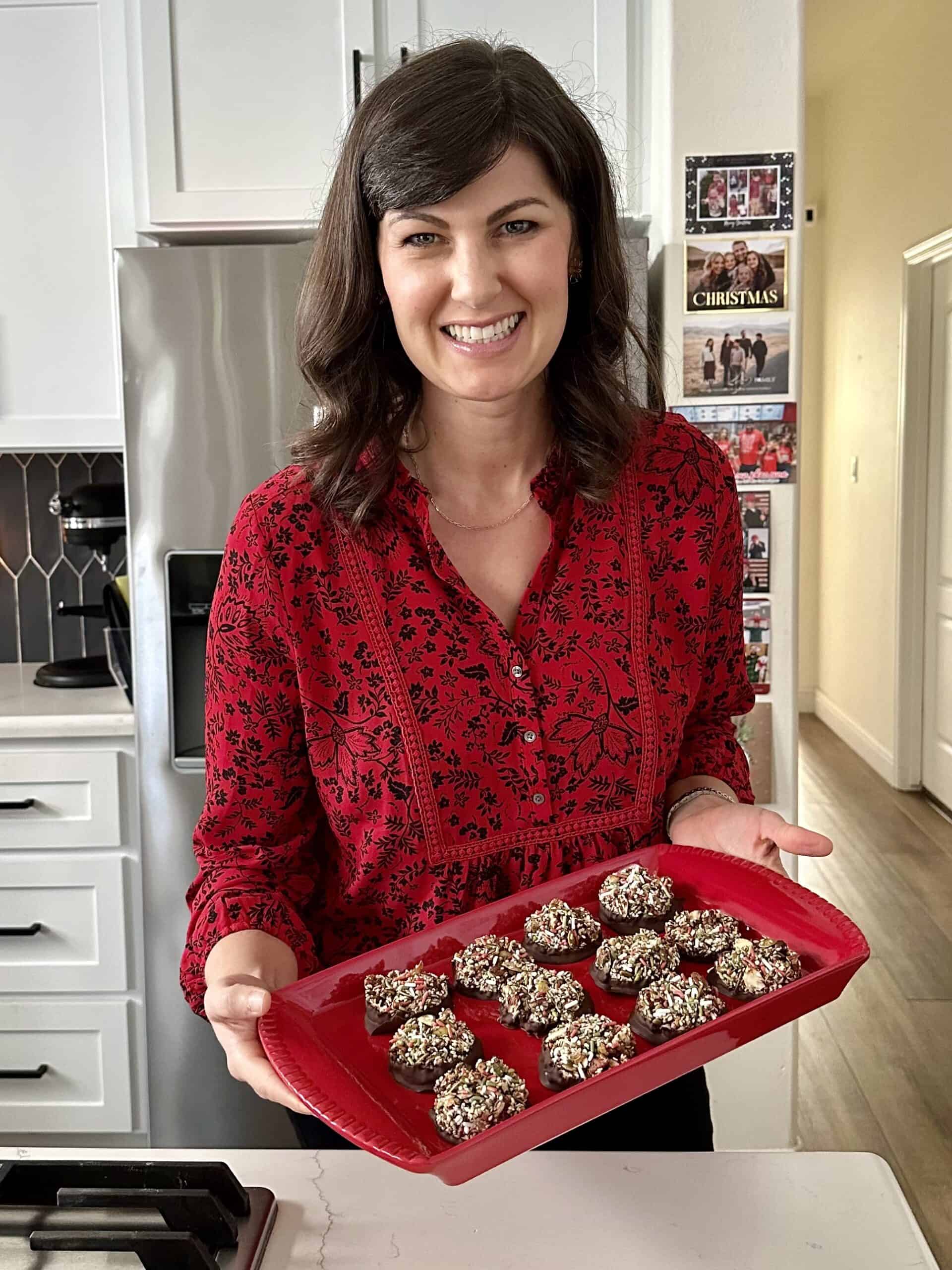 Aimee from Homemaker on a Budget presents chocolate dipped Nut Clusters with dark chocolate with nuts.