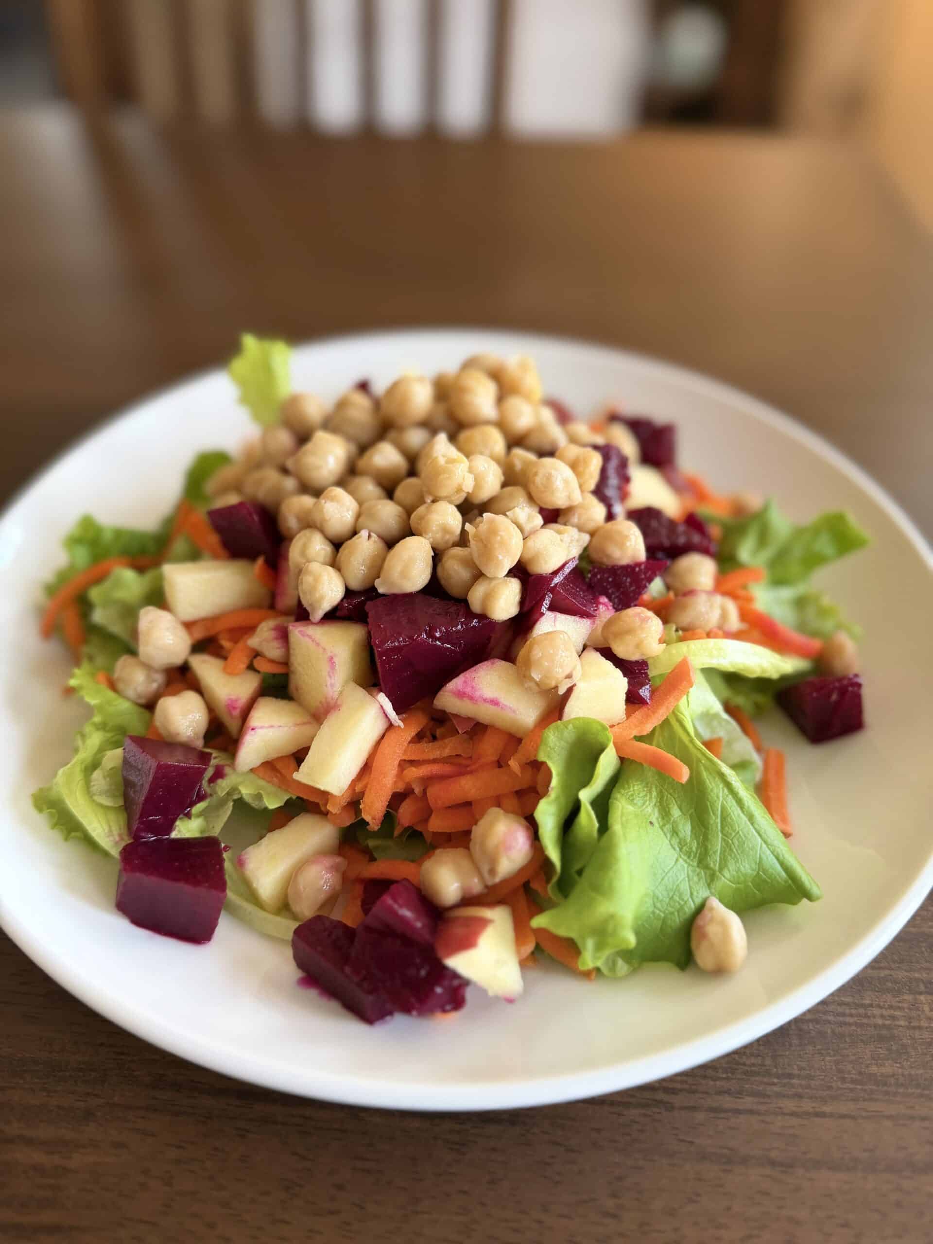 Aimee from Homemaker on a Budget chops apples, beets and carrots for anti-cancer chopped salad.