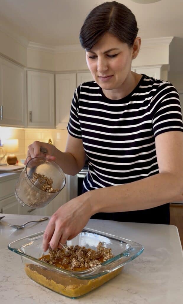 Aimee from Homemaker on a Budget makes topping  crumble for sweet potato crisp.