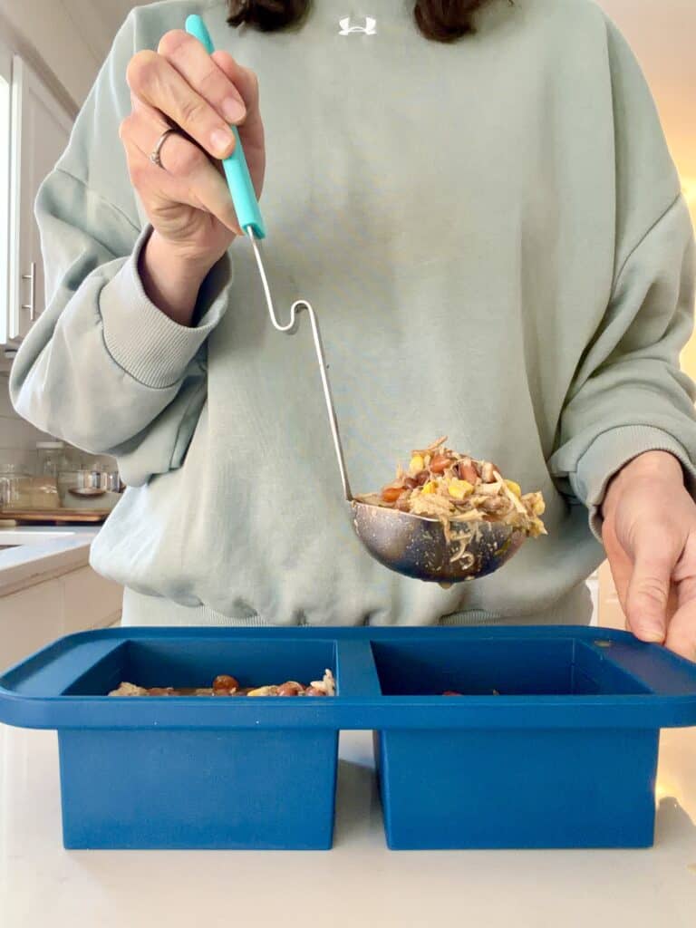 Aimee from Homemaker on a Budget stores crock-pot chicken taco soup in Souper Cubes.