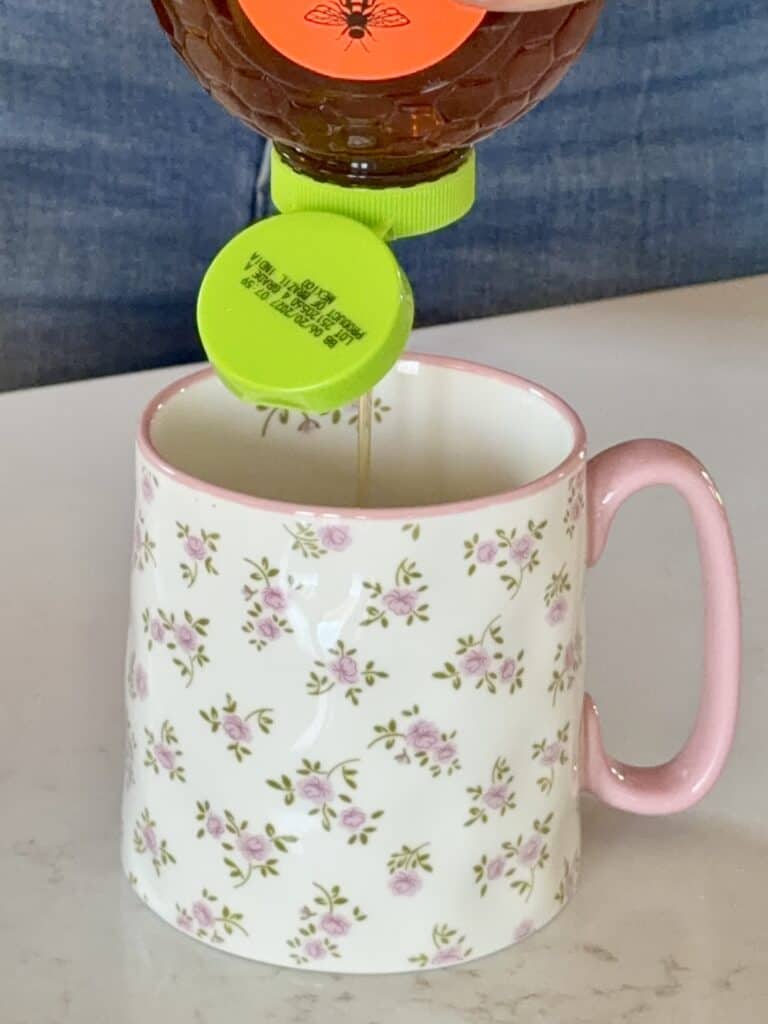 Aimee from Homemaker on a Budget adds honey to her 3-ingredient hot chocolate with cocoa powder.