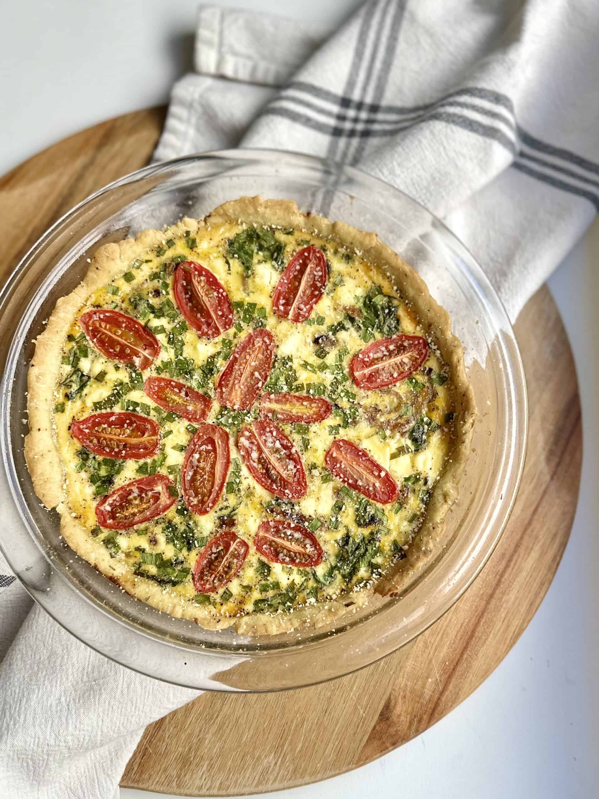 Aimee from Homemaker on a Budget serves homemade caramelized onion quiche.