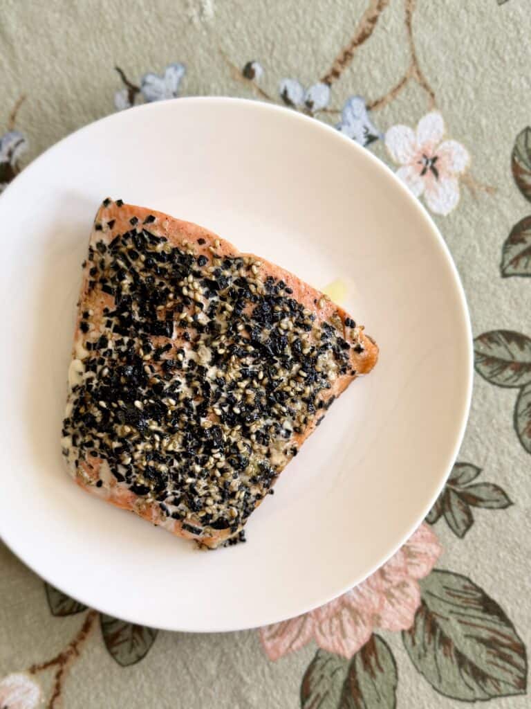 Aimee from Homemaker on a Budget dresses a frozen salmon fillet to bake and serve.