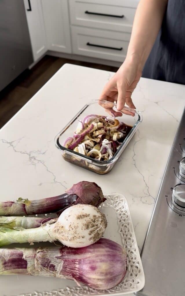 Aimee from Homemaker on a Budget allows red onions to marinate to release juices and flavors. 