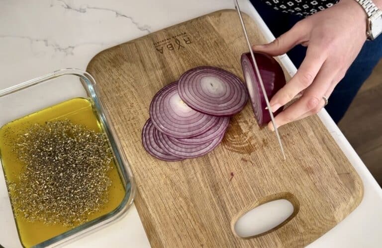 Aimee from Homemaker on a Budget prepares to make a homemade marinade for red onions.