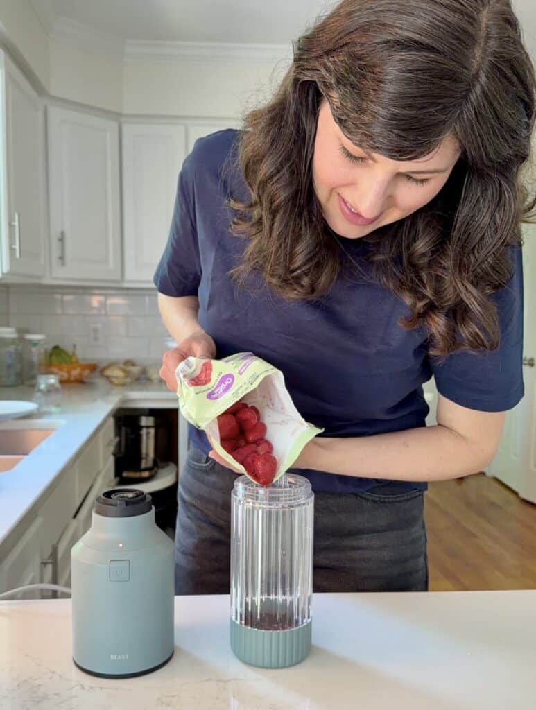 Aimee from Homemaker on a Budget prepares to make a simple 2-ingredient strawberry syrup.