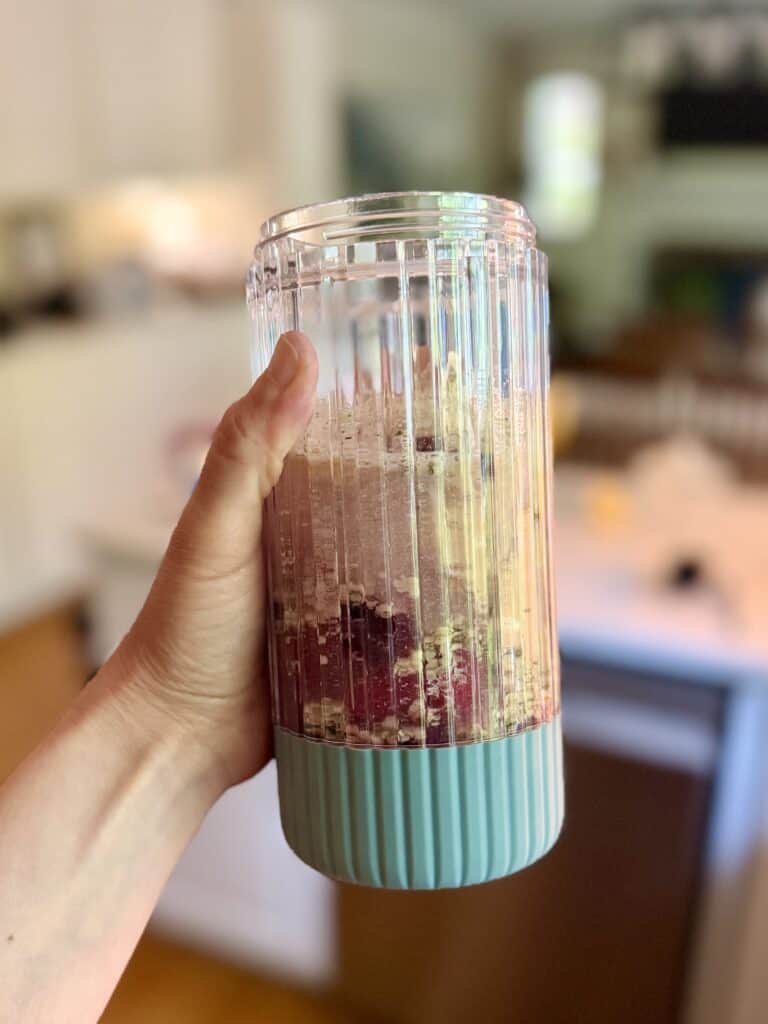 Aimee from Homemaker on a Budget blends ingredients for a powerful and delicious anti-inflammatory berry smoothie.