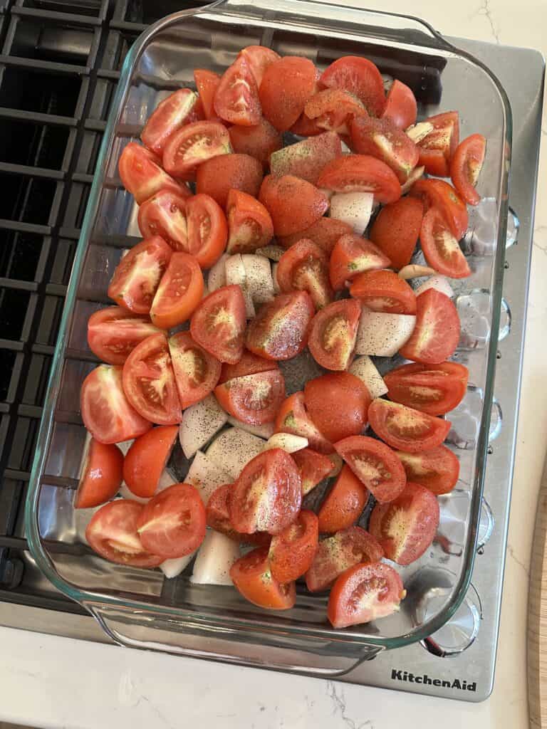 Aimee from Homemaker on a Budget prepares a combination of Roma tomatoes, garlic, onions, olive oil, and seasonings to create a healthy, homemade marinara sauce.