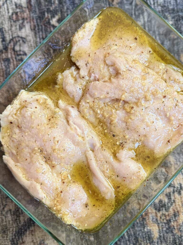 Aimee from Homemaker on a Budget marinades chicken breast in apple cider vinegar, olive oil, and seasoning blend. 