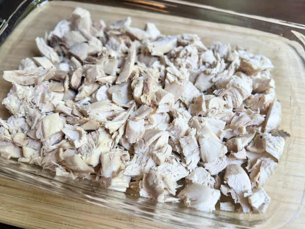 Aimee from Homemaker on a Budget starts her chicken with pineapple dish with chunks of whole-cooked chicken. 