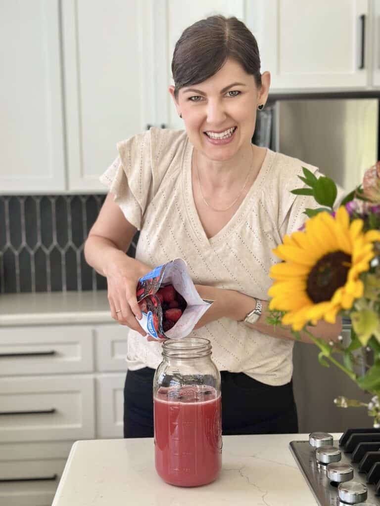 Aimee from Homemaker on a Budget mixes frozen berries into her healthy cranberry fruit punch.