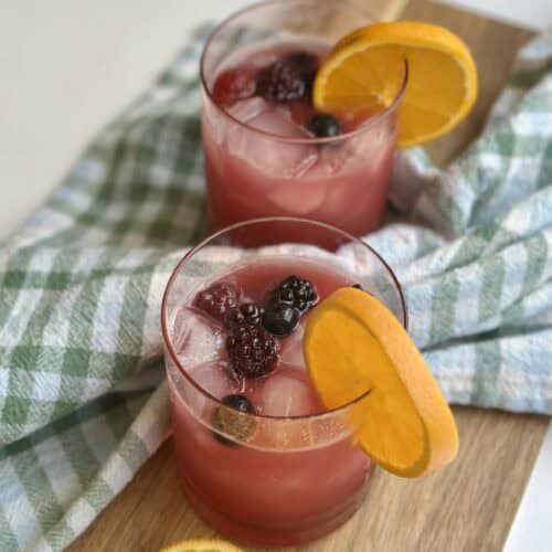 Aimee from Homemaker on a Budget spreads cheer serving a bright and refreshing cranberry punch.
