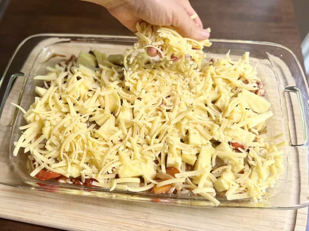 Aimee from Homemaker on a Budget uses her favorite Kerrygold cheese to top Hawaiian Chicken Bake, chicken with pineapple.
