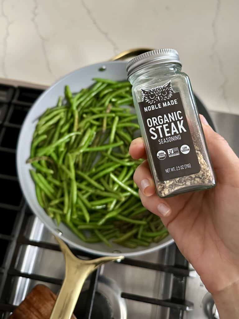Aimee from Homemaker on a Budget cooks up frozen french green beans with butter, olive oil, and seasoning for an easy side dish of low-carb green beans.