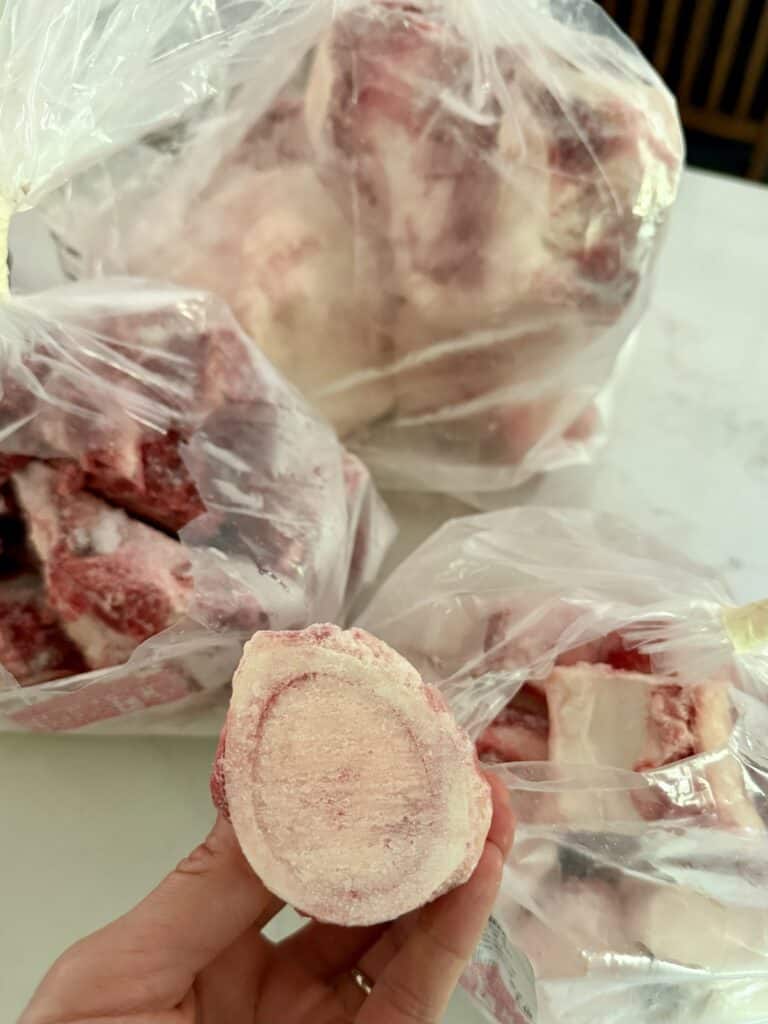Aimee from Homemaker on a Budget uses frozen, grass-fed beef cutlets and bones to make homemade bone broth in the Instant Pot.