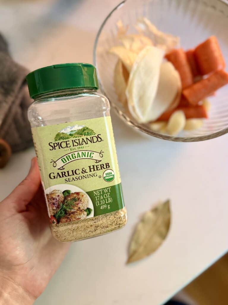 Using a garlic and herb seasoning, Aimee from Homemaker on a Budget enhances the flavor of homemade beef bone broth made in the Instant Pot.
