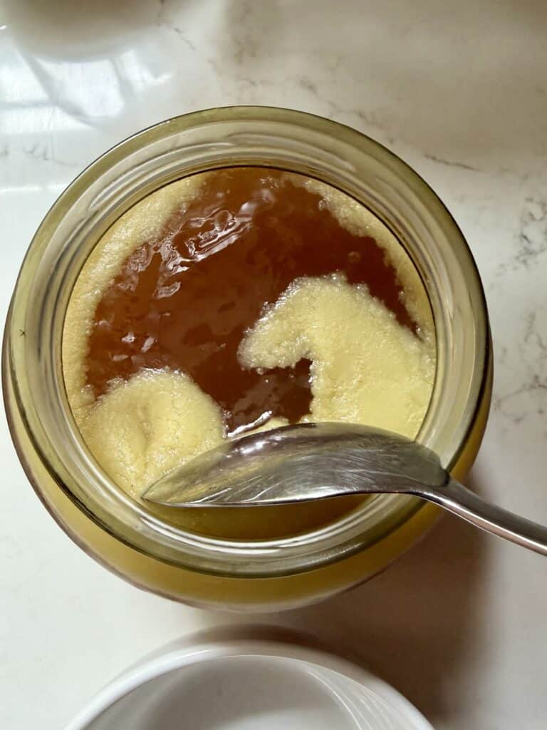 Aimee from Homemaker on a Budget shares how to distinguish the solid fats from the liquid in beef marrow bone broth.