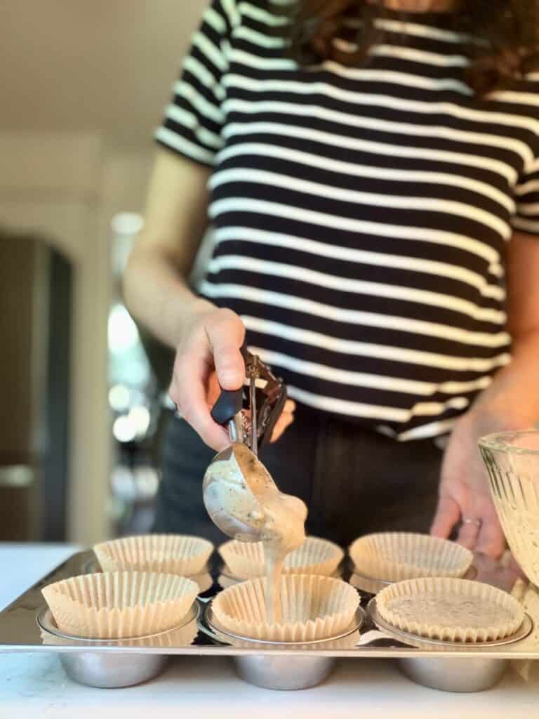 Aimee from Homemaker on a Budget shows us how to measure batter into muffin tin for blueberry pancake muffins. 