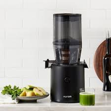 Aimee from Homemaker on a Budget uses a Hurom juicer to make cucumber watermelon juice. 