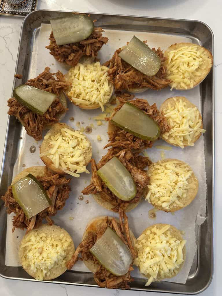 Aimee from Homemaker on a Budget serves all-natural BBQ sauce on sliders with cheese and pickles. 