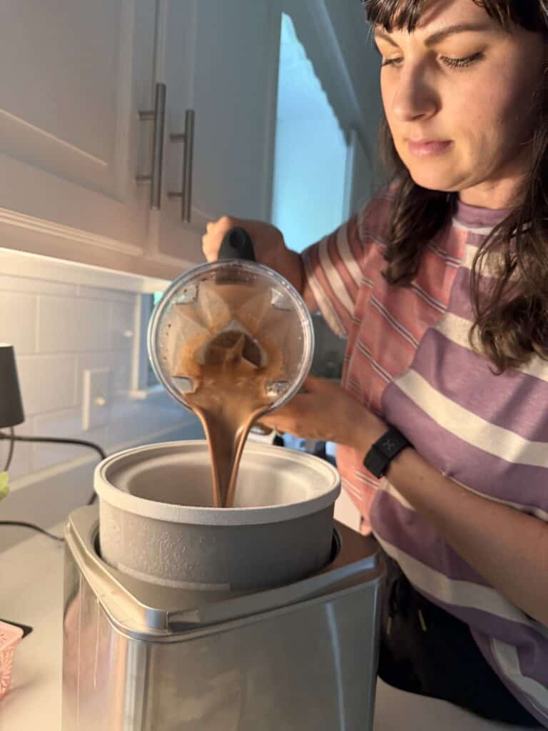 Aimee from Homemaker on a Budget adds coconut milk, cacao powder, and maple syrup to an ice cream maker to create a delicious and creamy homemade ice cream for summer. 