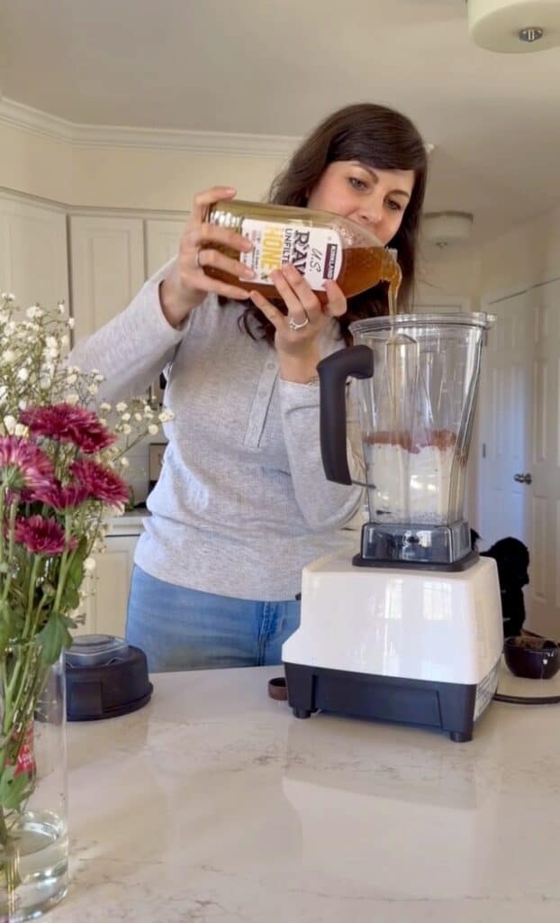Aimee from Homemaker on a Budget sweetens the recipe with honey as she  blends ingredients in chocolate chia seed pudding with protein powder. 