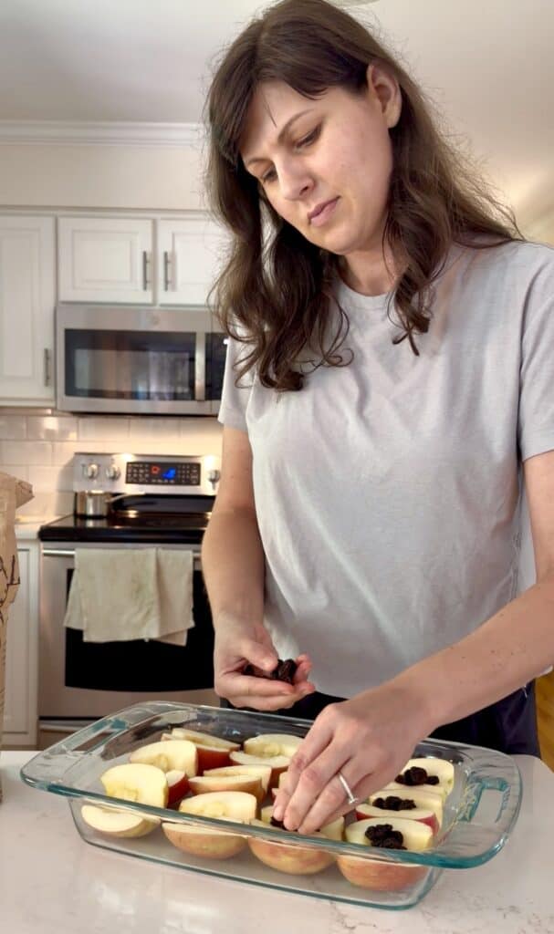 Aimee from Homemaker on a Budget tops each apple with plump raising to create a kid-friendly apple dessert that's gluten-free and healthy. 
