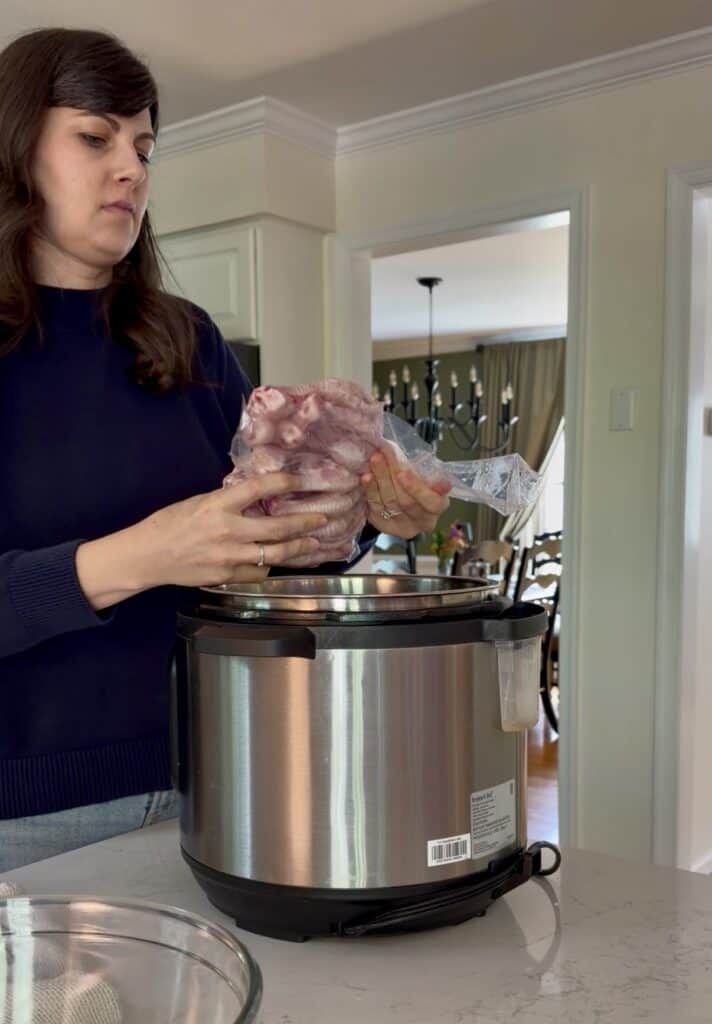 Preparing to make a highly nutritious collagen broth, Aimee from Homemaker on a Budget uses high-quality chicken feet as the base of her recipe. 
