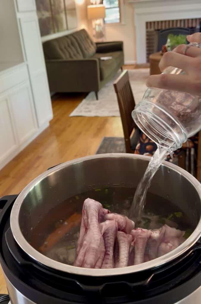 Aimee from Homemaker on a Budget shares her chicken feet collagen bone broth recipe instructions for Instant Pot and slow cooker. 
