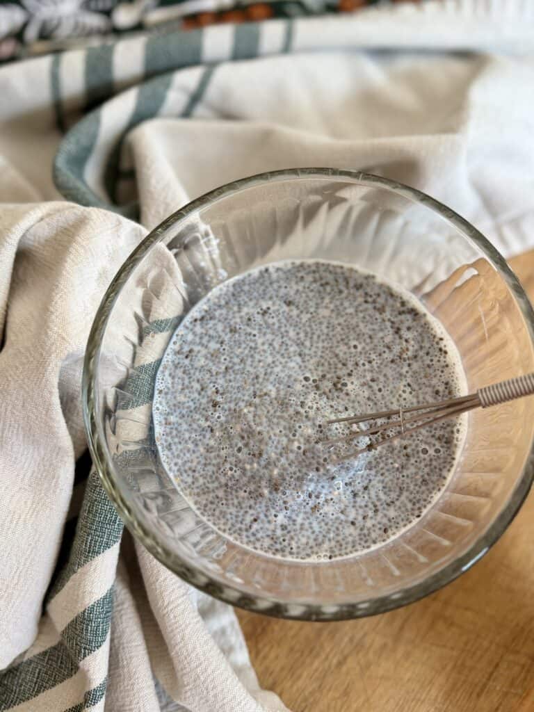 Aimee from Homemaker on a Budget whisking chia seeds and milk to make pumpkin chia seed pudding. 