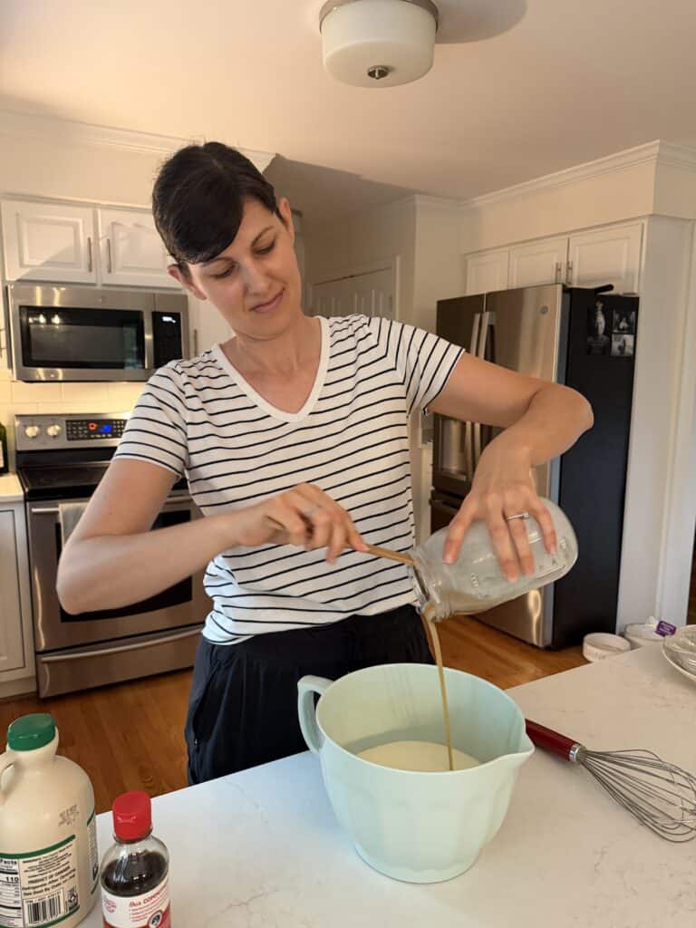 Adding a teaspoon of pure vanilla extract, Aimee from Homemaker on a Budget creates her signature homemade vanilla ice cream in a Cuisinart ice cream maker. 