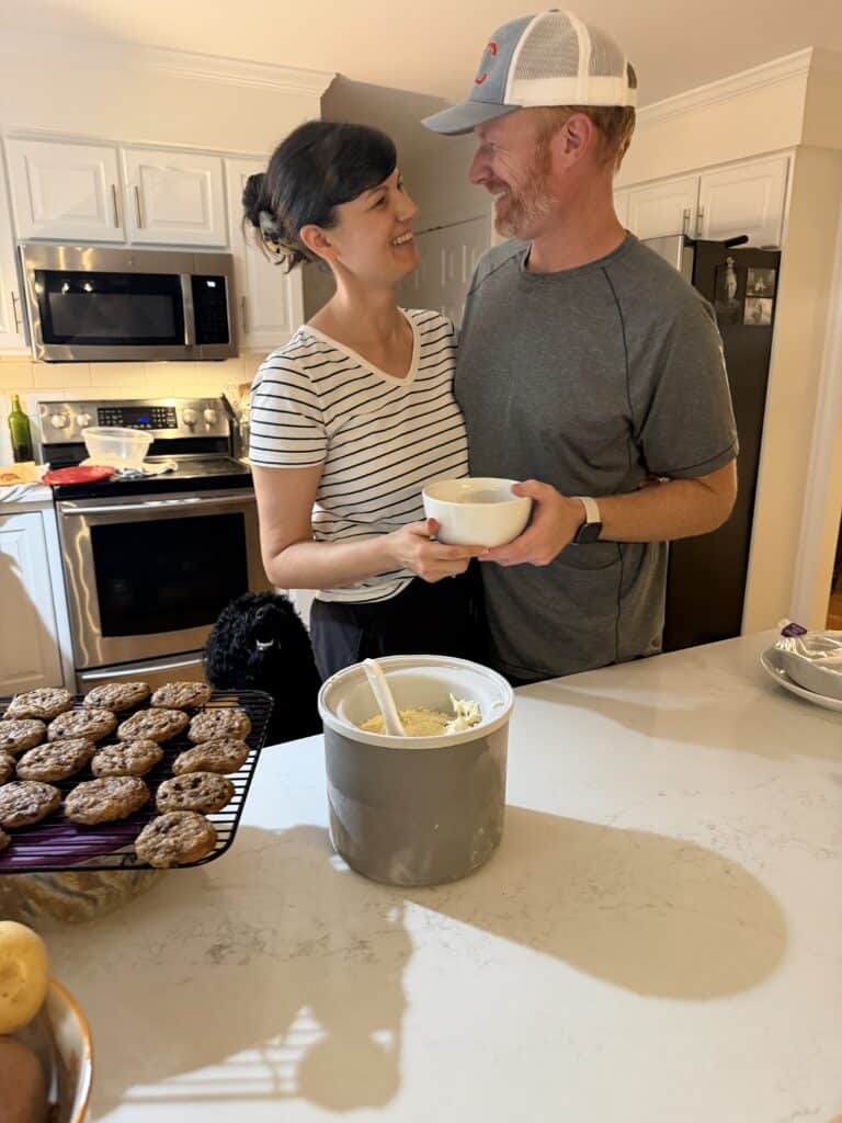 Aimee from Homemaker on a Budget and her husband share a hug and a smile while enjoying a family favorite treat- homemade maple vanilla ice cream! 