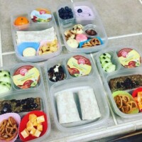 banana bread slice, cheese chunks, gf pretzels, cucumber and applesauce, bean and cheese burritos, pancake muffins