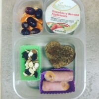 ham and cheese roll-up, oatmeal cinnamon muffin, nuts, raisins, and yogurt raisins, grapes and cutie orange, applesauce