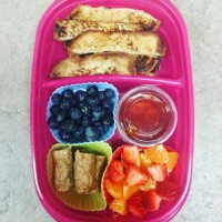 french toast sticks and pure maple syrup, blueberries, strawberries and cutie orange, sausage
