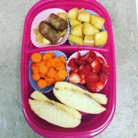 gluten-free english muffin with butter, honey and cinnamon, carrots, strawberries, boiled apples, sausage