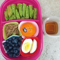 green spinach oatmeal pancakes with pure maple syrup, sausage, cutie orange, blueberries, hard boiled egg